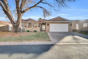 View of front of property with a garage