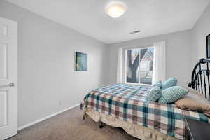 Bedroom featuring carpet flooring