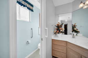 Bathroom with toilet and vanity