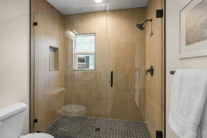 Bathroom with an enclosed shower and toilet