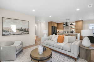 Living room with light hardwood / wood-style floors