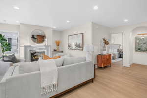 Living room with light hardwood / wood-style flooring