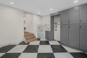 Mudroom with lockers and Double stack Washer and Dryer