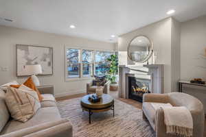 Living room with light hardwood / wood-style flooring