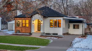 View of front facade featuring a yard (  2 car detached car located in back