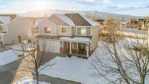 View of front facade featuring a mountain view and a garage