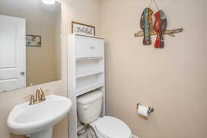 Bathroom featuring sink and toilet