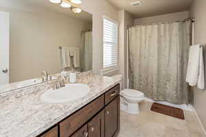 Bathroom with toilet and vanity