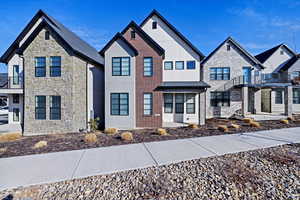 View of front of home featuring brick siding