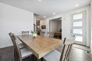 Dining area with recessed lighting, visible vents, stairway, hardwood / wood-style floors, and baseboards