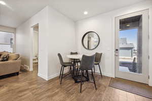 Dining room with recessed lighting, visible vents, baseboards, and wood finished floors