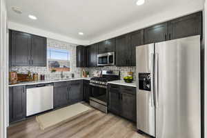 Kitchen featuring tasteful backsplash and quartz countertops