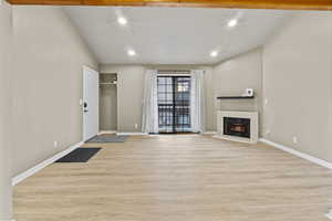 Unfurnished living room featuring light hardwood / wood-style floors