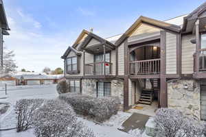 View of front of property featuring a balcony