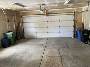 Garage featuring a garage door opener