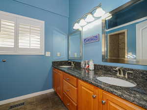 Primary main floor bathroom with double sinks