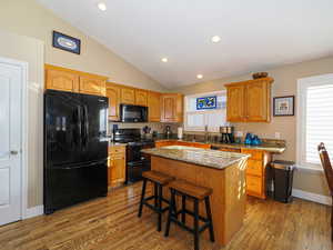 Bright kitchen with island and all appliances