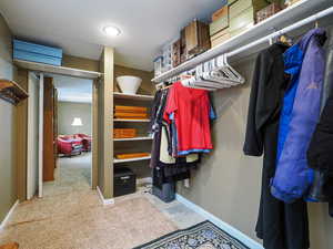 Walk in closet off basement living room