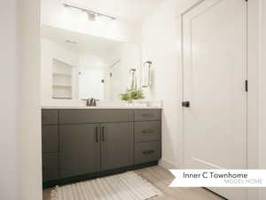 Bathroom with wood-type flooring and vanity