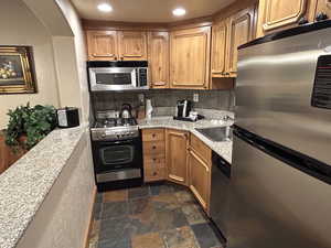 Full Kitchen featuring granite countertops and stainless steel appliances
