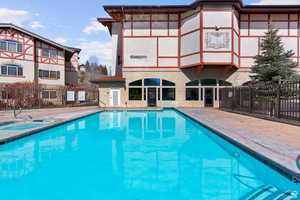 View of swimming pool featuring a patio