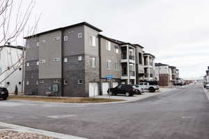 View of property featuring detached garage