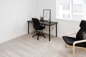 View of carpeted home office/ bedroom