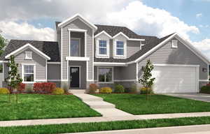 View of front of home with a garage and a front yard