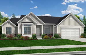 Craftsman inspired home featuring a front lawn and a garage