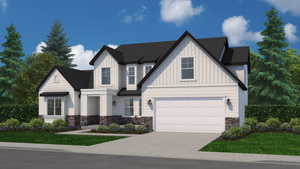 View of front of home with a garage and a front yard
