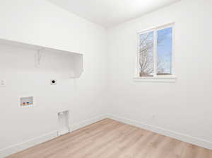 Laundry room with hookup for a washing machine, light hardwood / wood-style flooring, and hookup for an electric dryer