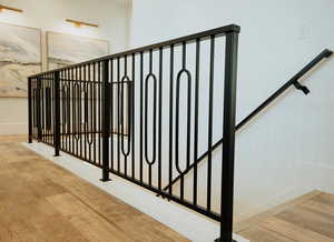 Staircase with hardwood / wood-style flooring