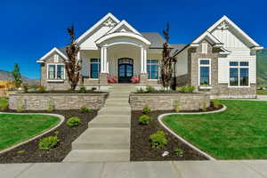 Craftsman-style house with a front yard