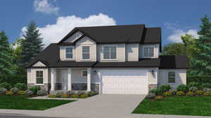 View of front of home featuring a front yard and a garage