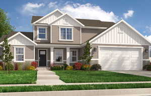 Craftsman-style home with a front yard and a garage