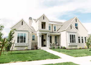 View of front of property with a front yard