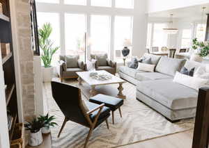 Living room with wood-type flooring and a chandelier