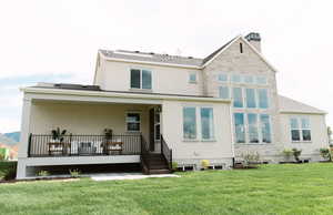 Rear view of house with a lawn