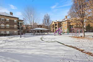 Exterior space featuring a playground and a gazebo