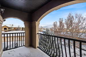 View of snow covered back of property