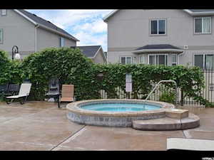 View of pool featuring a patio area and a hot tub