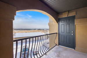 View of snow covered back of property