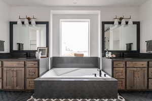 Bathroom with a bathtub and vanity