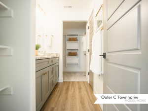 Bathroom featuring hardwood / wood-style floors and vanity