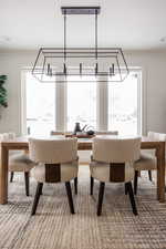 Dining area featuring plenty of natural light and ornamental molding