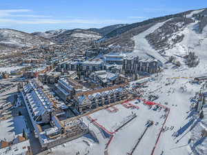 Snowy aerial view featuring a mountain view