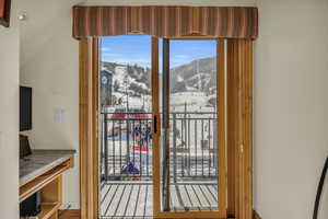 Doorway featuring a mountain view