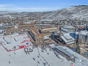 Snowy aerial view featuring a mountain view