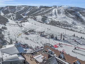 Snowy aerial view featuring a mountain view