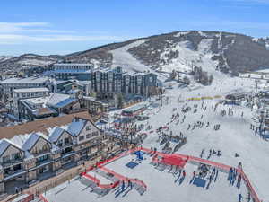 Snowy aerial view featuring a mountain view